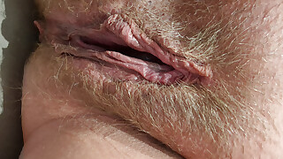 Wet slowly stroking in close-up